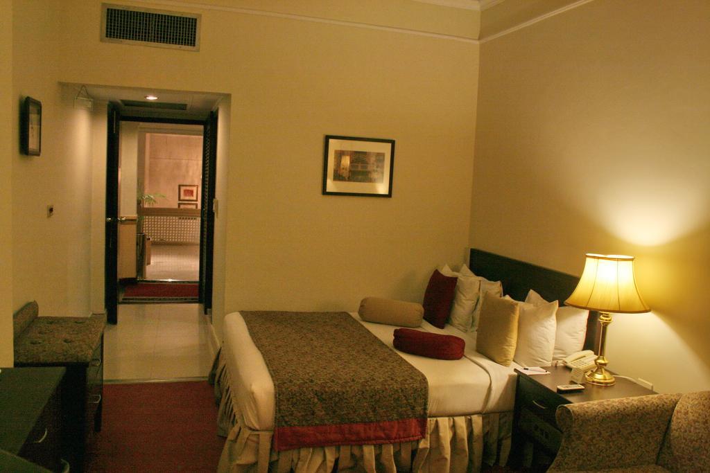 Smart Hotel Lahore Habitación foto